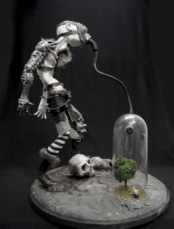 Will Ferreira, 2013. Mixed media sculpture of a transhumanoid breathing precious clean air through a mask connected to a glass bottle containing the last tree on Earth